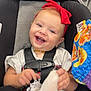 Oaklynn joined the competition — help win amazing prizes! baby, car_seat, child, clothing, colorful, cute, floor, frilly_sock, happy, indoor, infant, person, playing, red_headband, seatbelt, smiling, sock, store, toy, white_sock
