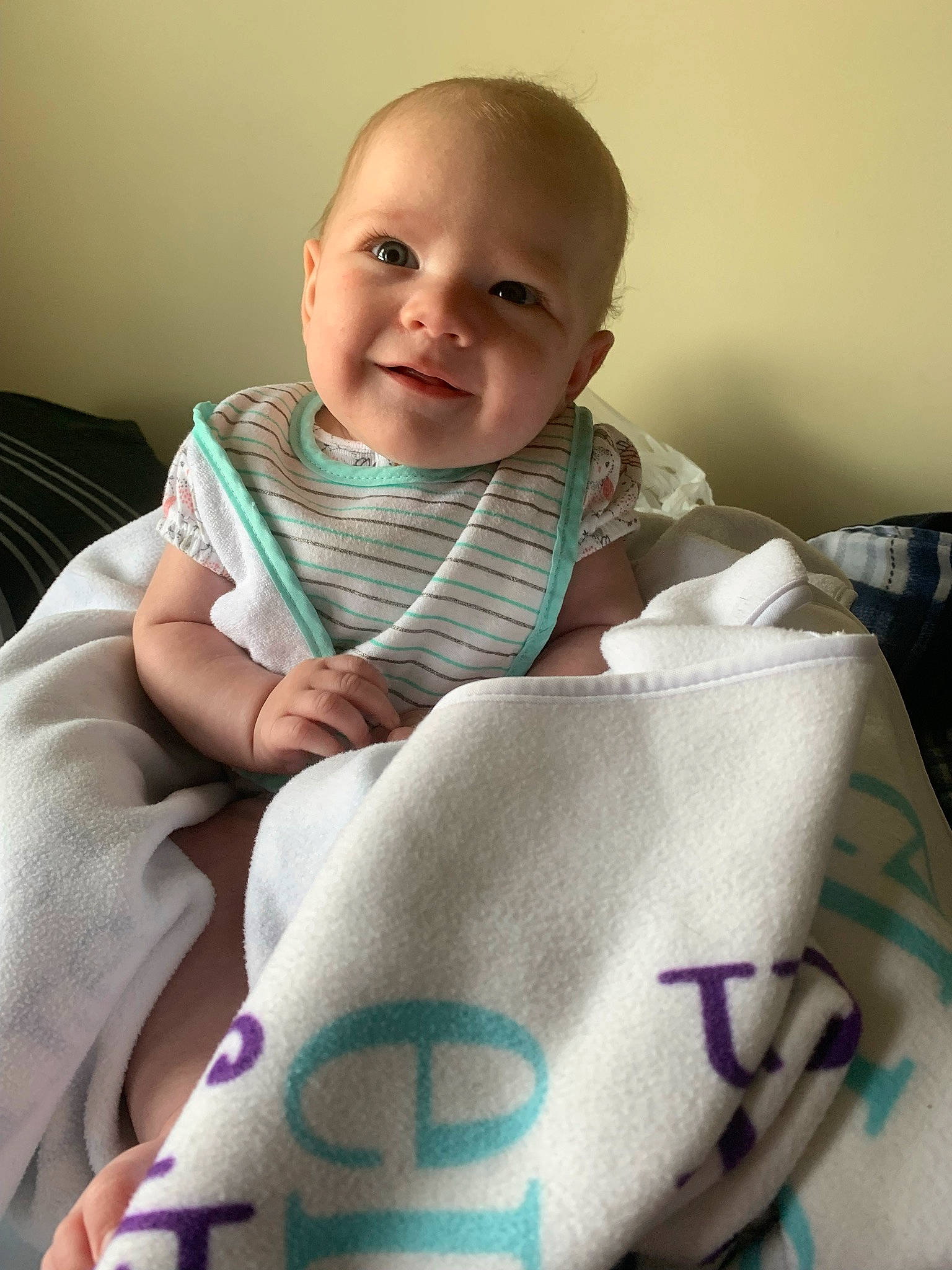 Ellen is registered to the contest to win money with this photo: baby, baby_products, baby_safety, baby_toddler_clothing, bedding, cheek, child, comfort, eyebrow, finger, happy, joy, linens, neck, person, product, room, skin, sleeve, smile