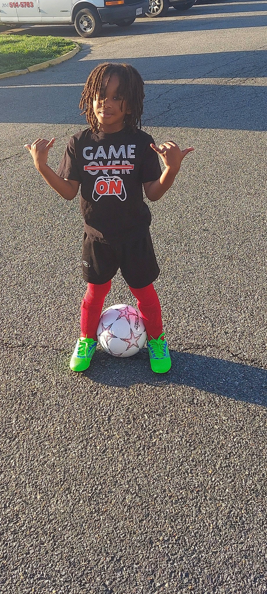 King is registered to the contest to win money with this photo: ball, ball_game, football, grass, jersey, person, player, shorts, sneakers, soccer, soccer_ball, soccer_player, sock, sports, sports_equipment, sports_gear, sports_uniform, sportswear, t_shirt, team_sport