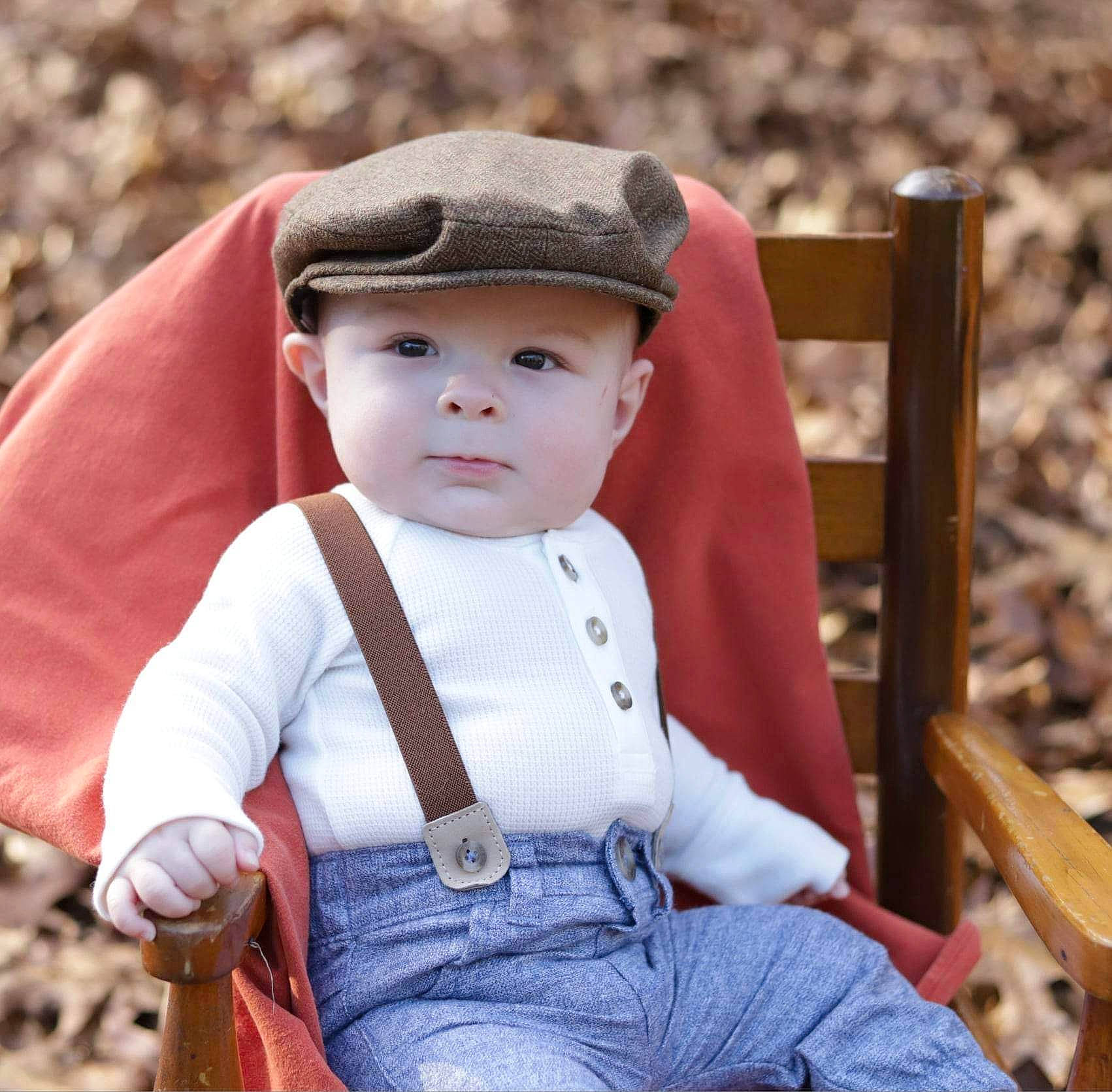 Kolten joined the competition — help win amazing prizes! baby, baby_toddler_clothing, cap, chin, eye, facial_expression, fun, grass, happy, headgear, headwear, mammal, outerwear, people_in_nature, person, sitting, skin, sleeve, standing, toddler
