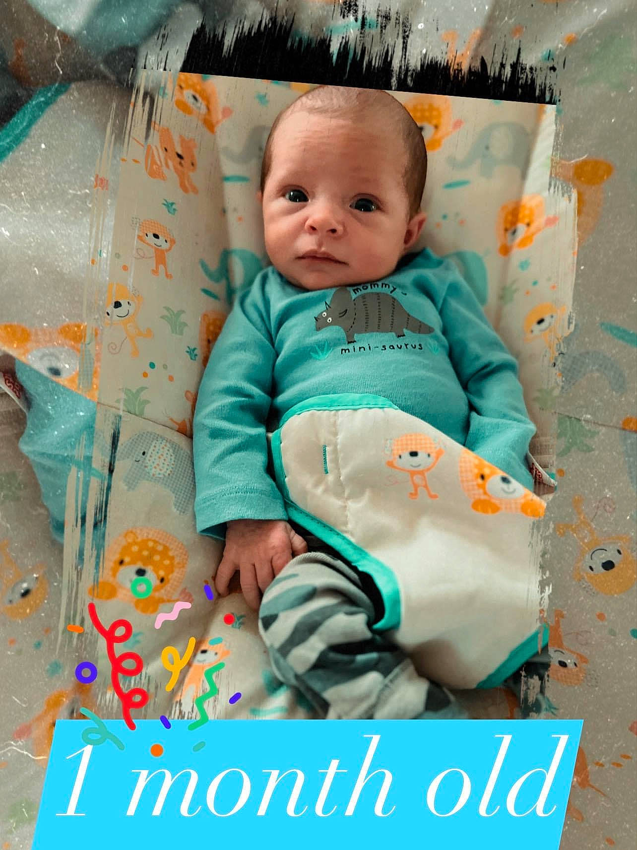 Cash is registered to the contest to win money with this photo: aqua, baby, baby_products, baby_toddler_clothing, child, comfort, happy, linens, pattern, person, pink, play, portrait_photography, room, sitting, sleeve, t_shirt, textile, toddler