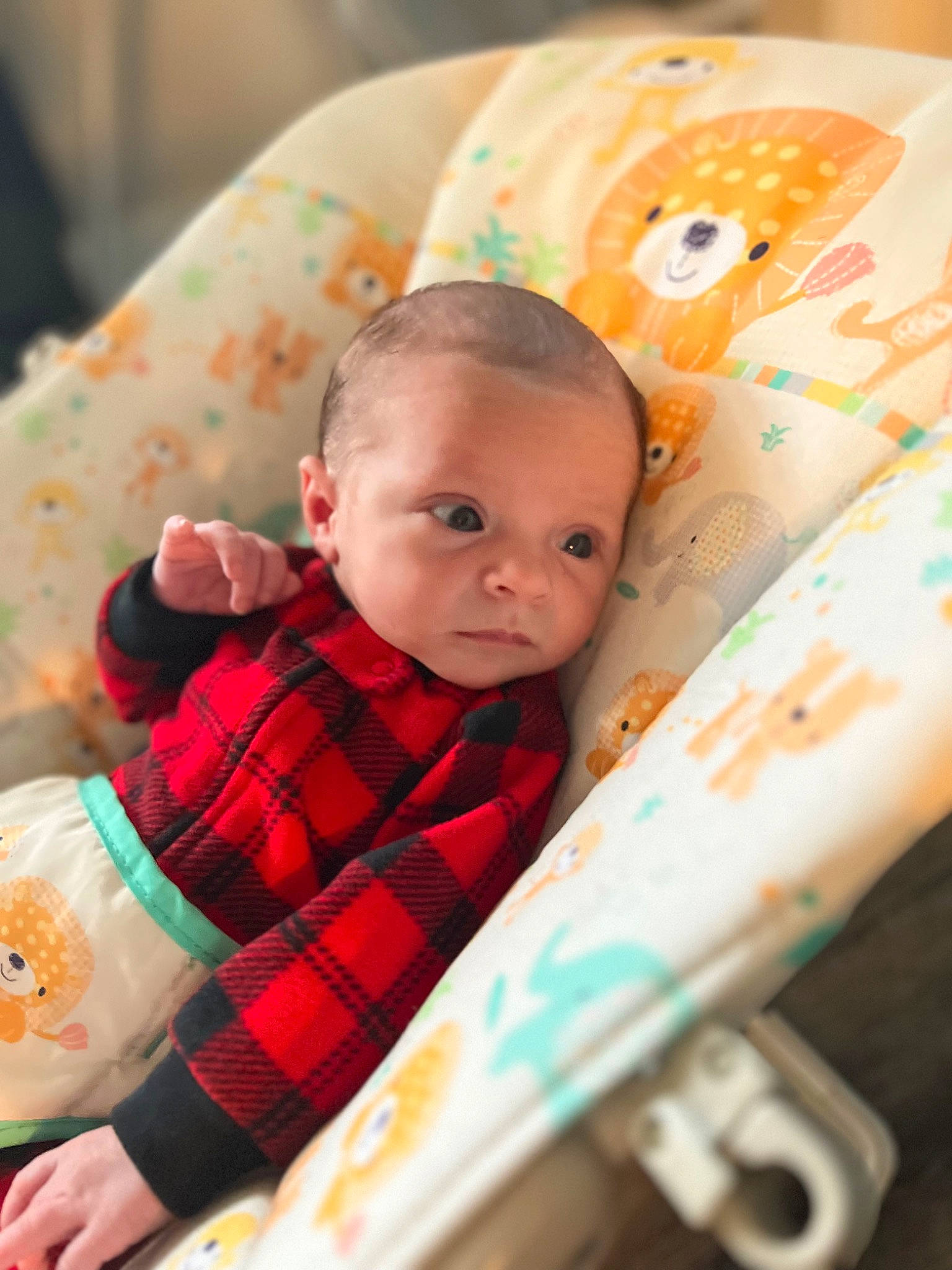 Cash is registered to the contest to win money with this photo: baby, baby_products, baby_toddler_clothing, cheek, child, christmas, comfort, eye, fun, happy, linens, orange, pattern, person, plaid, room, sitting, skin, tartan, textile