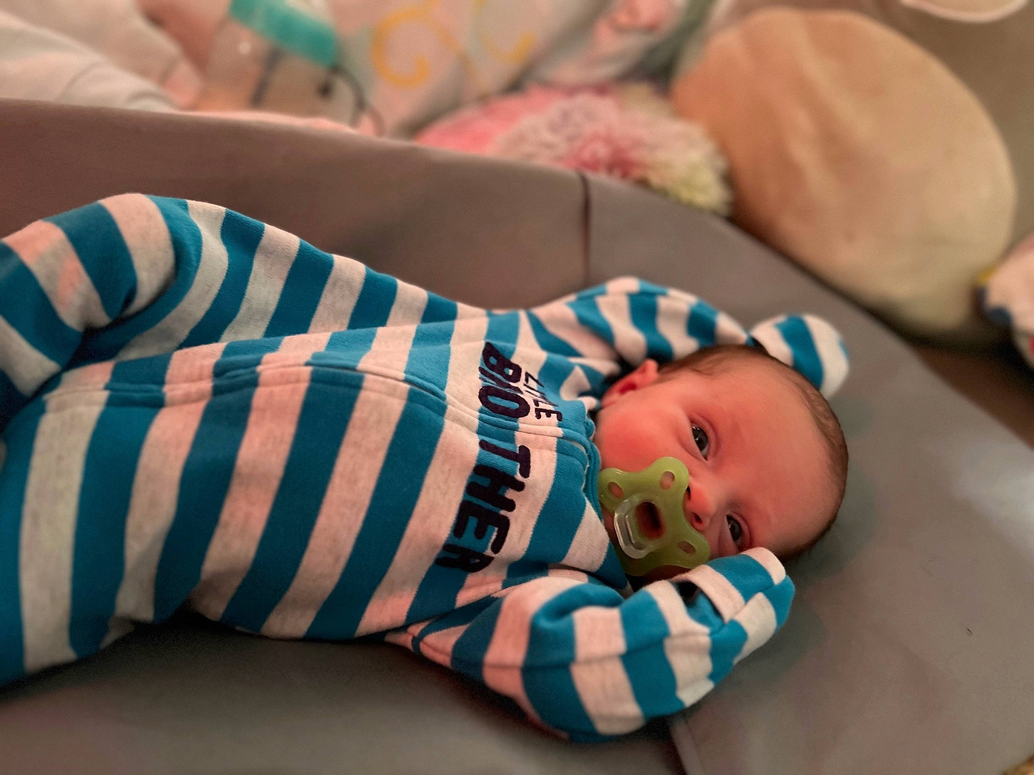Cash is registered to the contest to win money with this photo: baby, baby_products, baby_sleeping, baby_toddler_clothing, child, comfort, couch, elbow, eye, finger, human_body, human_leg, leg, linens, nail, pattern, person, room, skin, sleeve