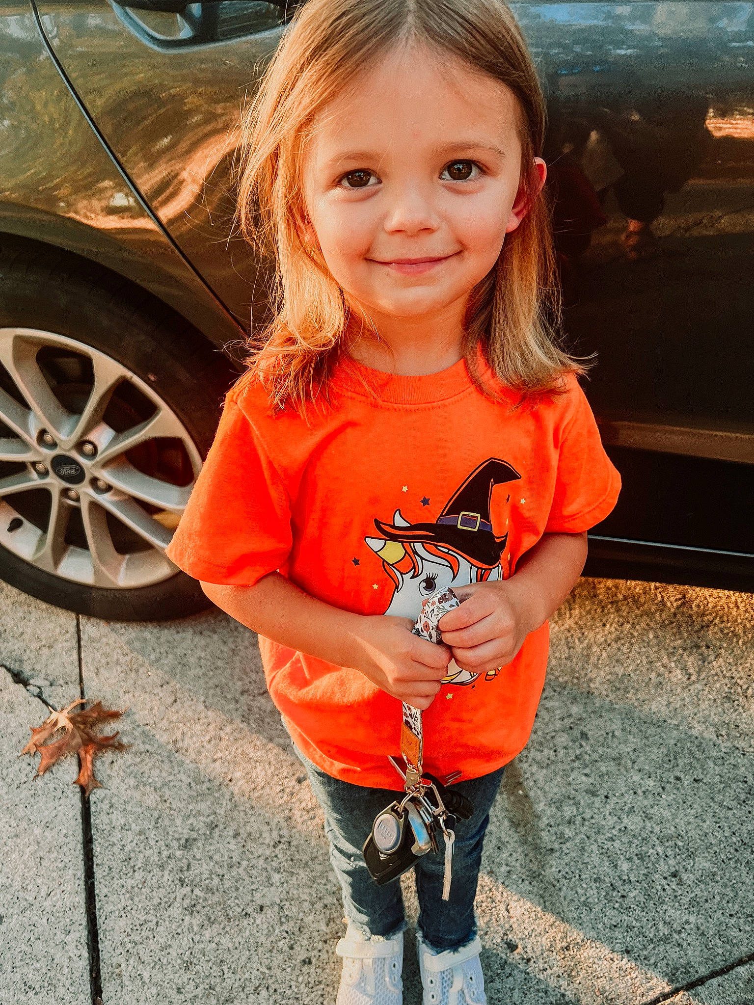 Brooks joined the competition — help win amazing prizes! automotive_tire, baby_toddler_clothing, car, cool, eye, face, facial_expression, hairstyle, happy, head, human_body, joy, orange, person, photograph, sleeve, smile, t_shirt, tire, toddler