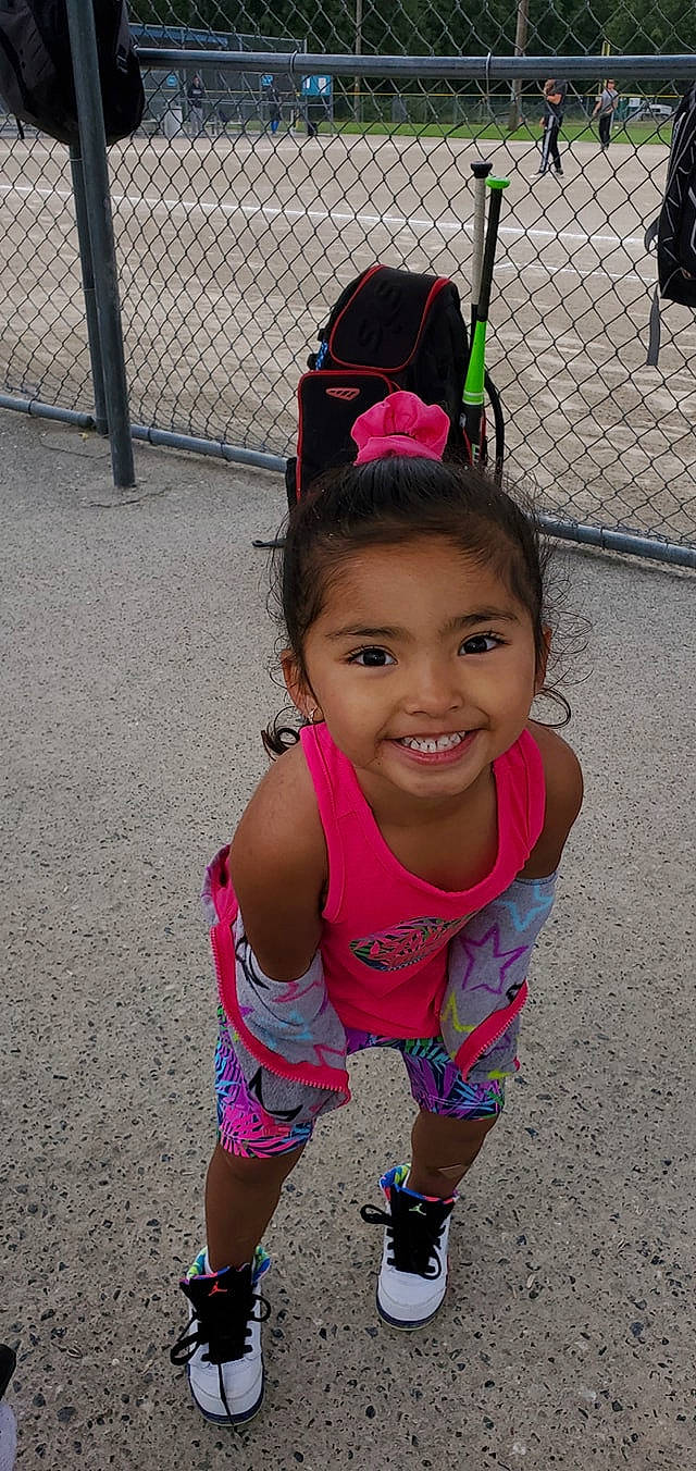 Saige joined the competition — help win amazing prizes! baby_toddler_clothing, child, cool, fashion_accessory, fence, fun, hair_accessory, happy, human_leg, joy, leisure, magenta, pattern, person, pink, play, recreation, sandal, smile, thigh