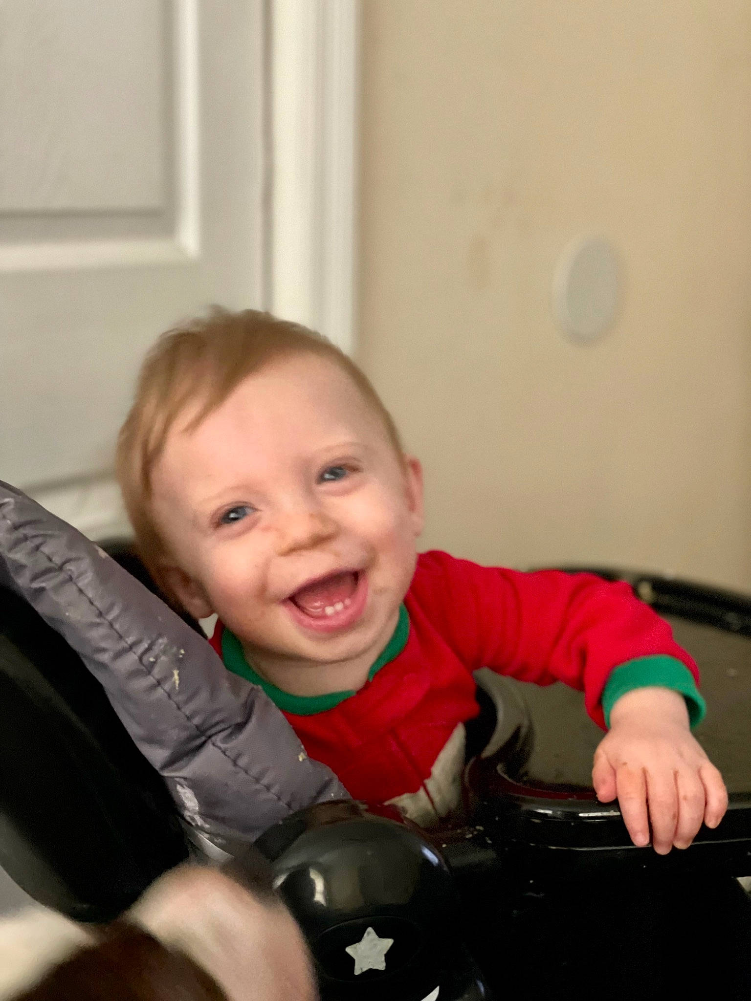 Aries is registered to the contest to win money with this photo: auto_part, baby, baby_toddler_clothing, chair, cheek, child, comfort, finger, flash_photography, flooring, fun, happy, lap, person, sitting, skin, sleeve, smile, thumb, toddler