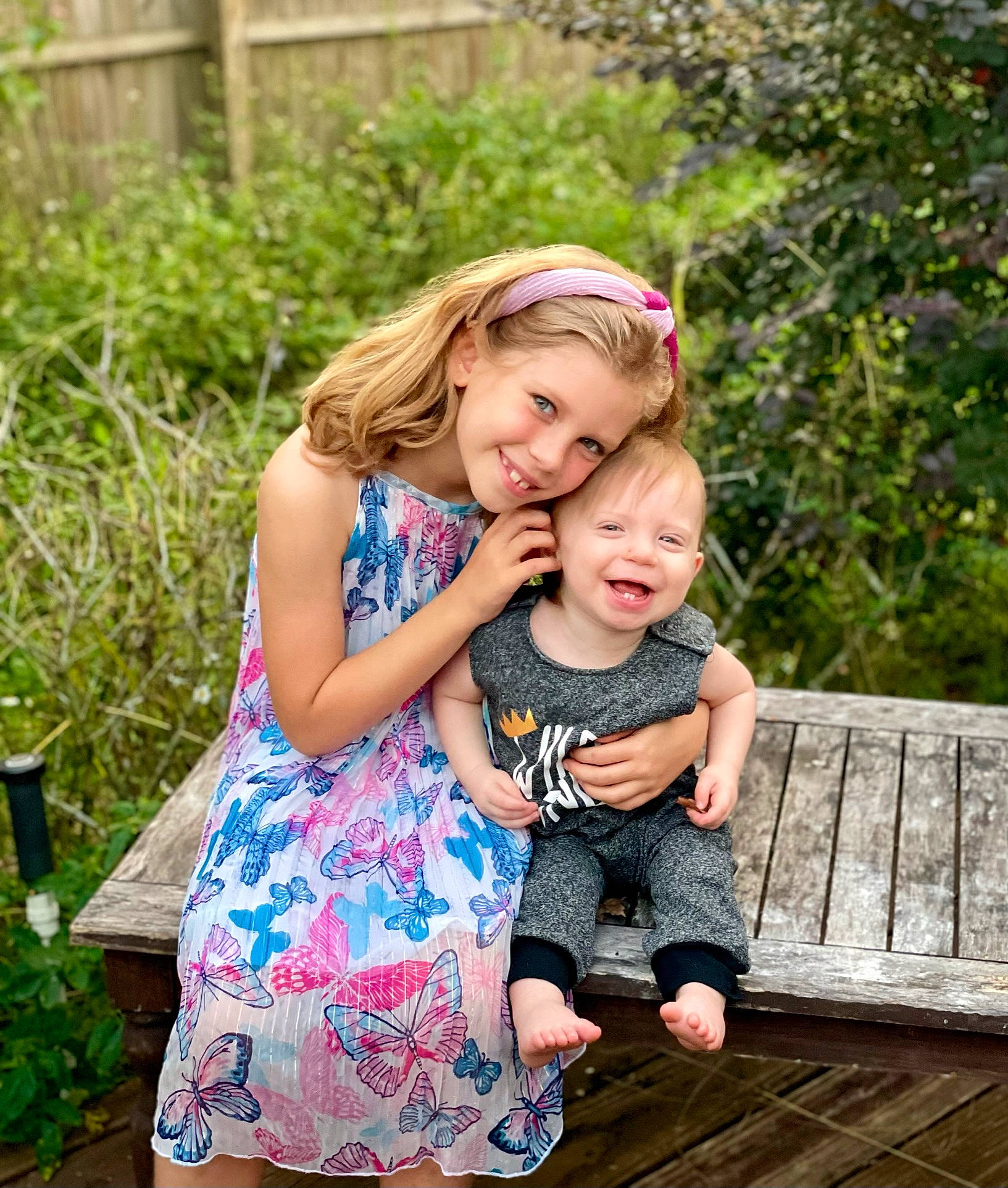 Isabelle is registered to the contest to win money with this photo: baby, baby_toddler_clothing, beauty, child, clothing, dress, flash_photography, fun, grass, green, happy, joy, leisure, people_in_nature, person, photograph, plant, sitting, skin, smile