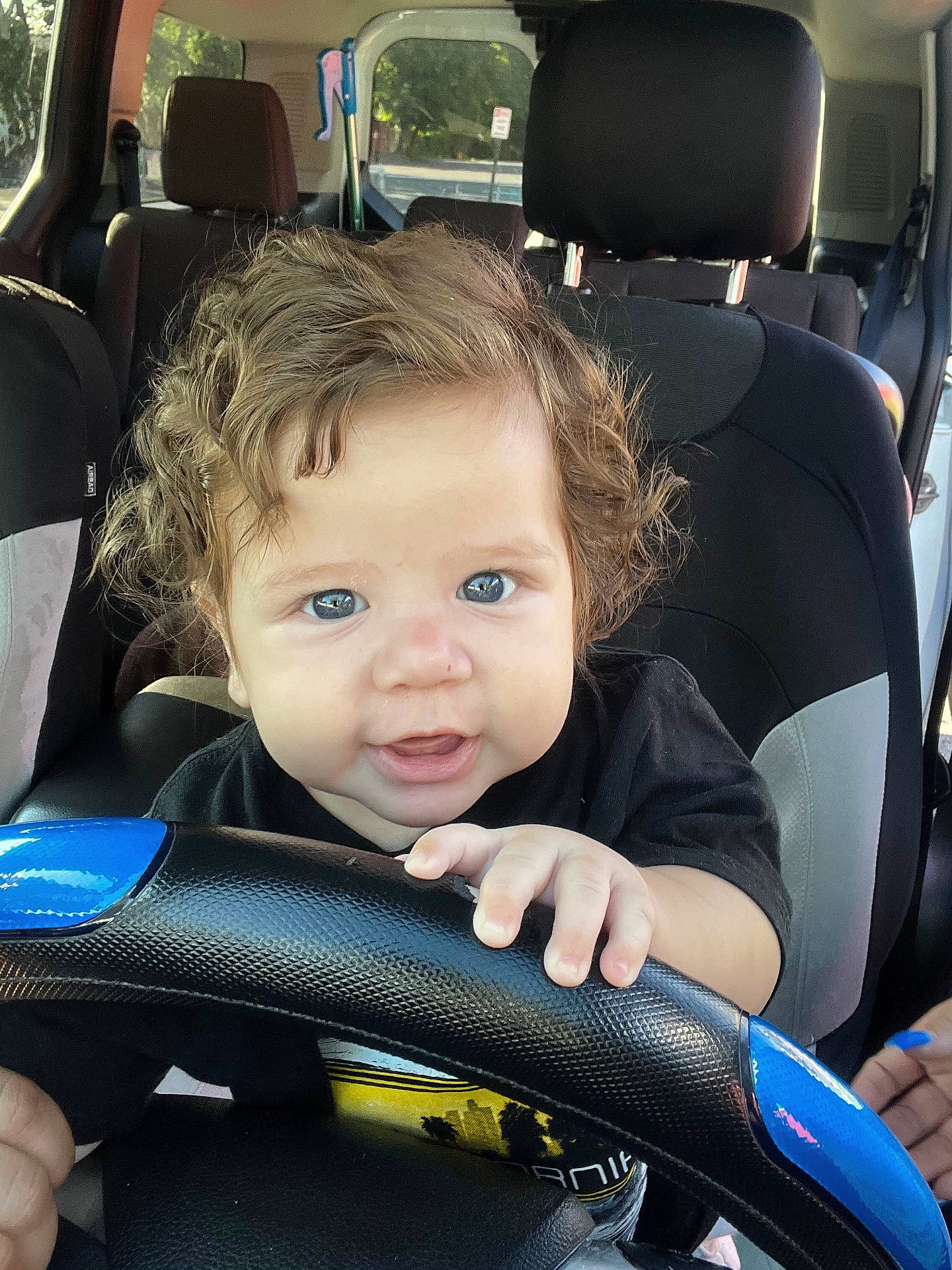 Jhonny joined the competition — help win amazing prizes! baby, car, car_interior, carseat, chair, clothing, cushion, driving, face, furniture, glove, happy, head, homedecor, person, photography, portrait, smile, transportation, vehicle