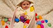 Madelyn is registered to the contest to win money with this photo: baby, basket, bunny_costume, child, colorful, cozy, cute, easter, festive, fluffy_blanket, happy, holiday, holiday_theme, indoor, plastic_eggs, playful, portrait, smiling, soft_texture, toy