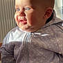 Bastien participe au concours pour gagner de l'argent avec cette photo : baby, child, face, blue_eyes, sunlight, jacket, zipper, patterned_clothing, cheeks, portrait, indoor, curious, smile, head, person, closeup, cute, soft_light, human, infant