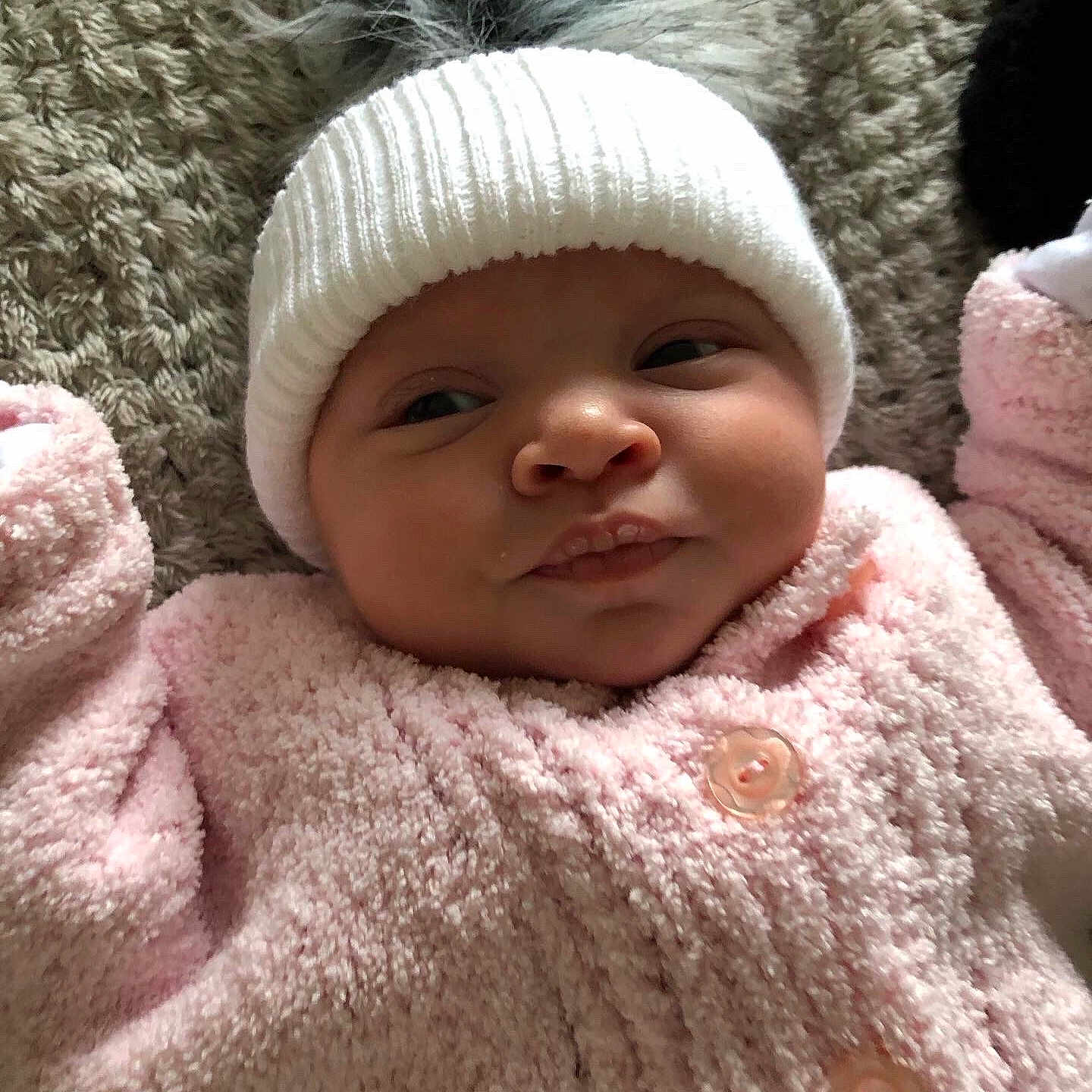 Aurora is registered to the contest to win money with this photo: baby, beanie, bonnet, cap, clothing, coat, face, glove, happy, hat, head, hood, jacket, knitwear, newborn, person, photography, portrait, smile, sweater