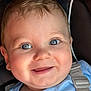 baby, baby_boy, blue_eyes, car_seat, child, childhood, close_up, clothing, cute, expression, face, happy, head, indoors, infant, person, portrait, seatbelt, skin, smiling