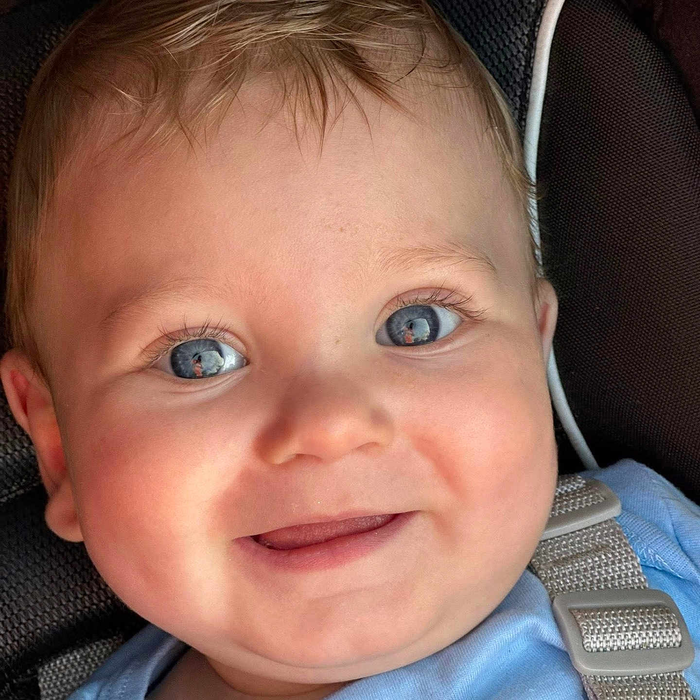 Miklo is registered to the contest to win money with this photo: baby, baby_boy, blue_eyes, car_seat, child, childhood, close_up, clothing, cute, expression, face, happy, head, indoors, infant, person, portrait, seatbelt, skin, smiling