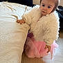 baby_clothing, blanket, child, couch, cute, expression, face, fashion, fluffy_jacket, hair, hair_bow, hand, indoor, living_room, pink_tutu, plush, portrait, standing, toddler, wooden_floor