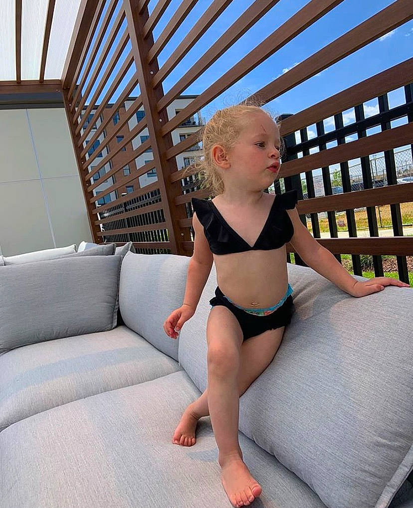 Azora Amani is registered to the contest to win money with this photo: blond, clothing, furniture, human_leg, leg, leotard, lingerie, person, photo_shoot, photography, room, sportswear, swimwear, thigh, undergarment, vacation