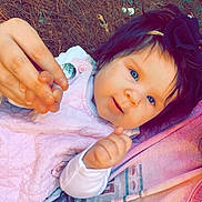 Charleigh Kate is registered to the contest to win money with this photo: baby, child, blue_eyes, bow, hand_holding, pink_clothing, outdoor, grass, leaves, person, cute, portrait, infant, young_child, happy, smiling, headband, face, skin, closeup