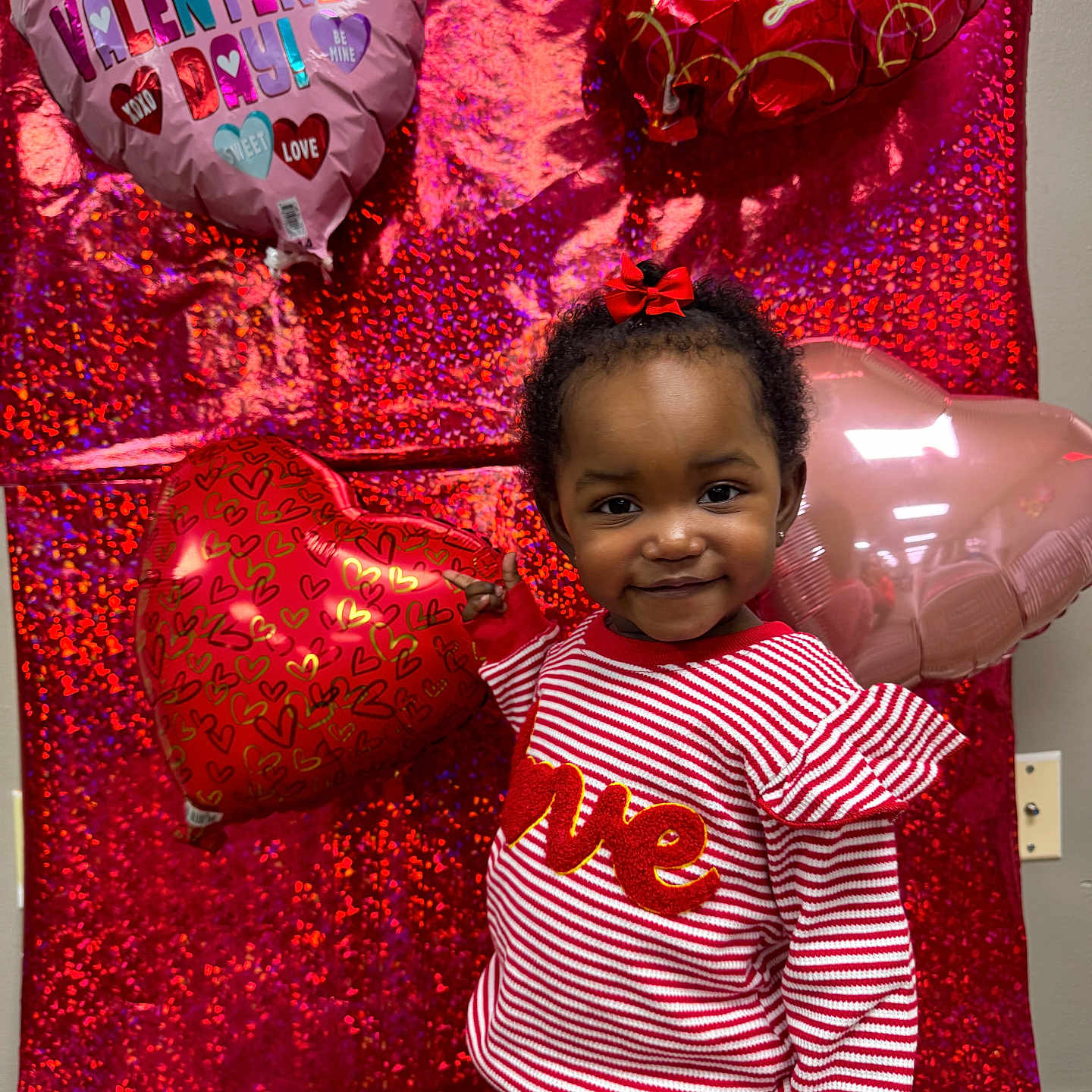 Daqariah joined the competition — help win amazing prizes! toddler, child, balloon, heart_shaped_balloon, valentines_day, red_background, striped_clothing, red_bow, smiling, indoor, holiday, festive, cute, portrait, person, celebration, love, happy, holding, fashion