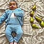 Kaely a rejoint le concours — aidez-le/la à gagner de superbes lots ! baby, infant, blue_clothes, knit_cardigan, knit_pants, white_onesie, pink_socks, bed, bedspread, pears, fruit, laying_down, portrait, neutral_expression, natural_light, cozy, soft_texture, curly_hair, adorable, cute