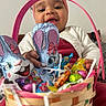 Kaely a rejoint le concours — aidez-le/la à gagner de superbes lots ! baby, basket, bunny, candy, celebration, child, chocolate, colorful, cute, easter, festive, foil_wrapped, happy, headband, holiday, indoor, person, pink, smiling, white_cardigan