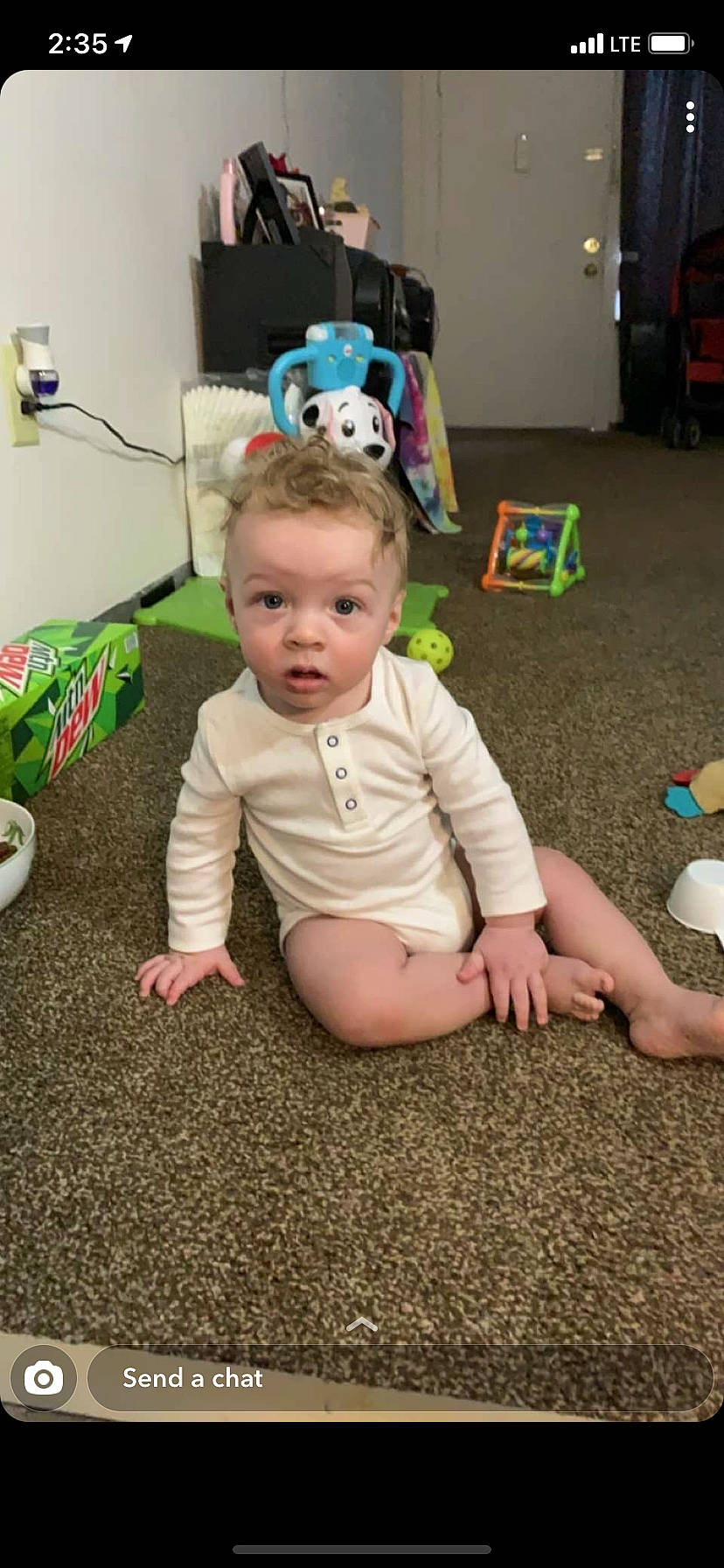 Jaylin joined the competition — help win amazing prizes! baby, baby_toddler_clothing, barefoot, child, floor, flooring, foot, fun, grass, happy, human_body, human_leg, person, play, room, sitting, sock, t_shirt, toddler, toy