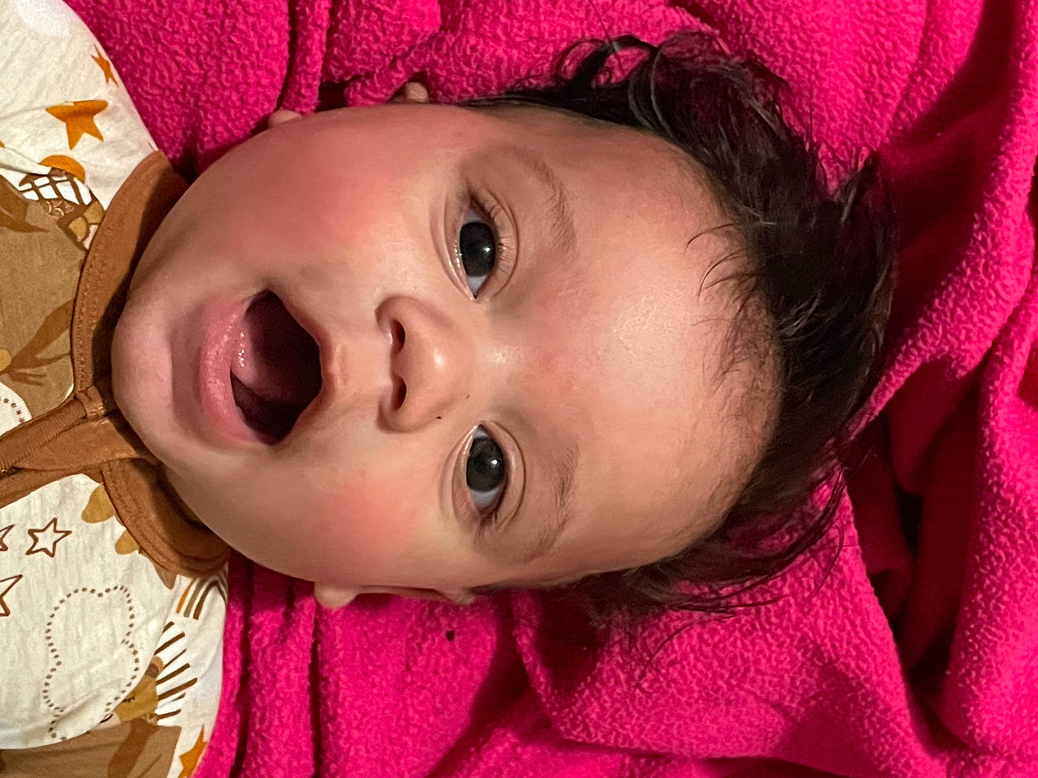 Tye is registered to the contest to win money with this photo: baby, cheek, chin, eye, eyebrow, eyelash, happy, head, headgear, human_body, iris, lip, mouth, nose, organ, person, pink, purple, skin, textile