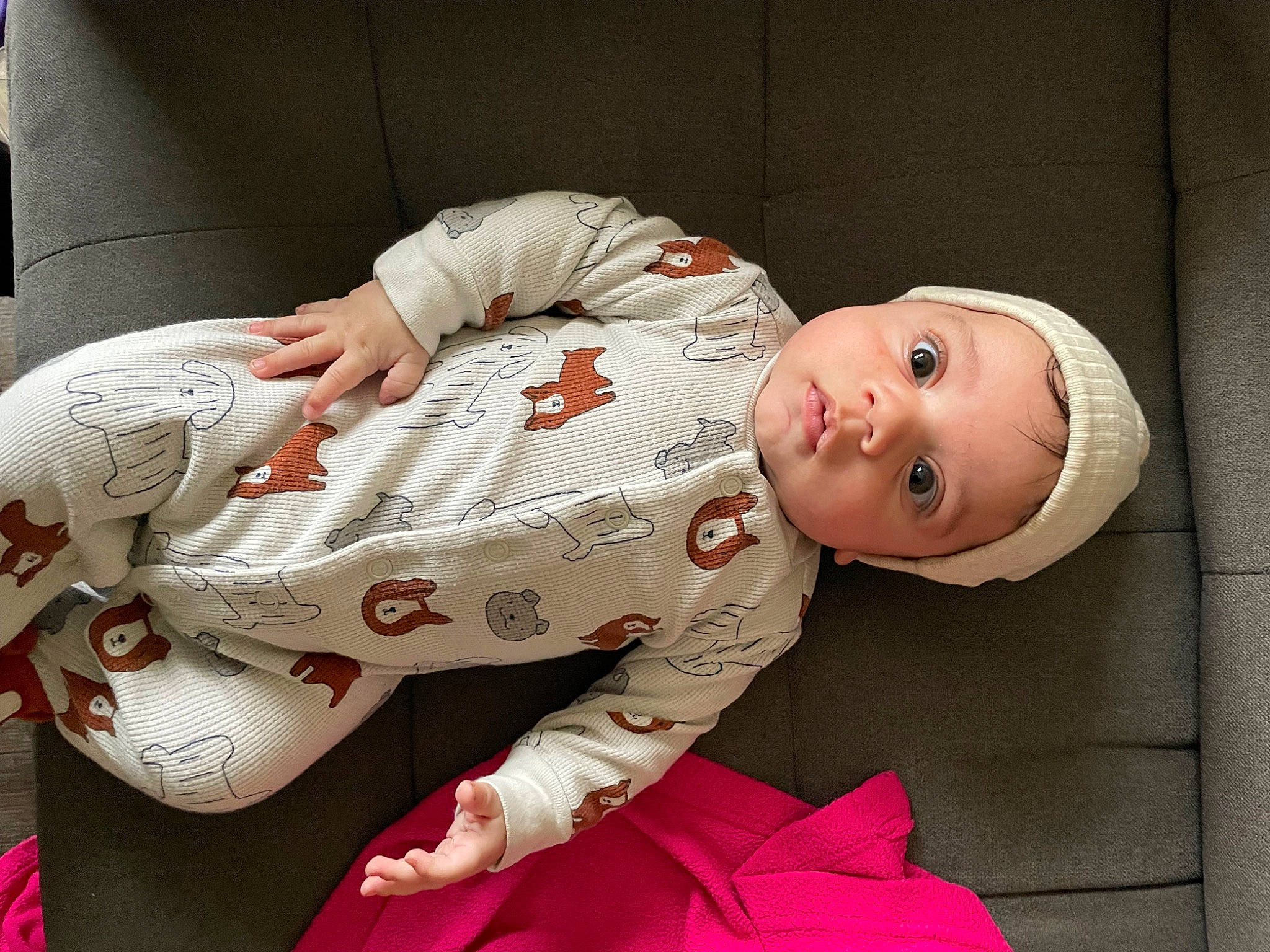 Tye is registered to the contest to win money with this photo: baby, baby_products, baby_safety, baby_toddler_clothing, carmine, cheek, child, collar, comfort, eye, flesh, linens, nightwear, pattern, person, pink, sitting, sleeve, smile, textile