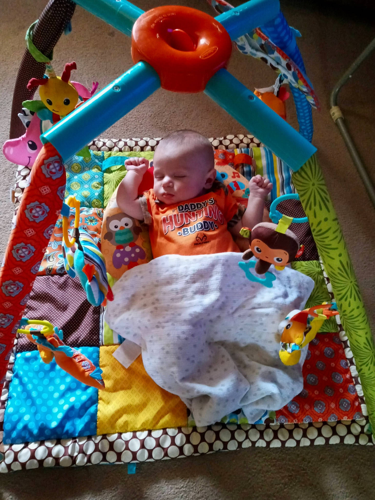 Myles is registered to the contest to win money with this photo: art, baby, baby_products, baby_toddler_clothing, baby_toys, bedtime, blanket, child, event, fun, linens, orange, pattern, person, play, product, room, stuffed_toy, textile, toddler