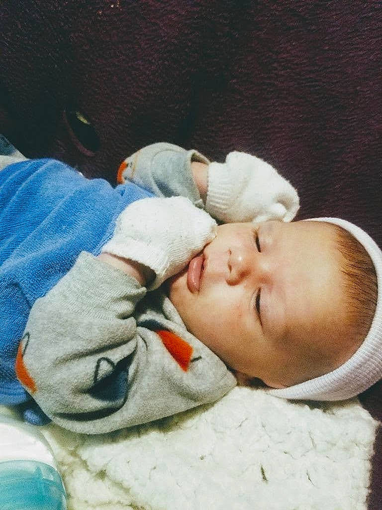 Myles is registered to the contest to win money with this photo: baby, baby_products, baby_sleeping, baby_toddler_clothing, bedtime, blanket, cheek, child, comfort, linens, nap, nose, person, portrait_photography, sleep, sleeve, toddler, vertebrate