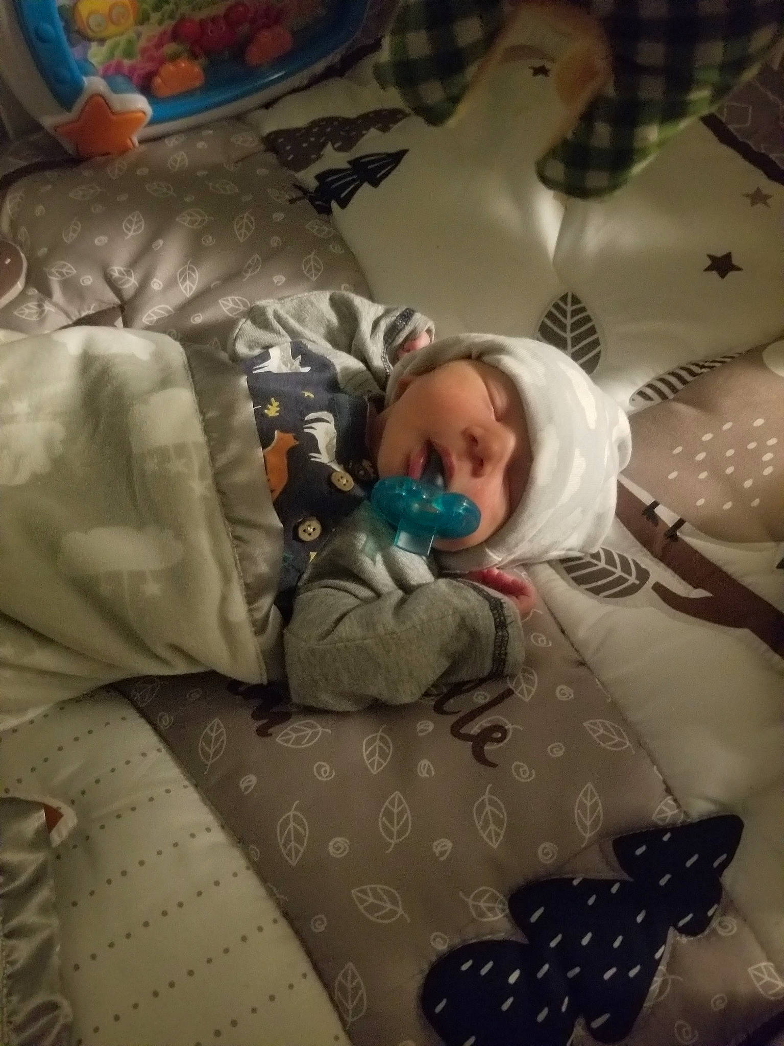 Myles joined the competition — help win amazing prizes! baby, baby_products, baby_toddler_clothing, bedding, bedtime, blanket, child, comfort, headwear, linens, nap, pattern, person, room, sleep, textile, toddler, toy, white