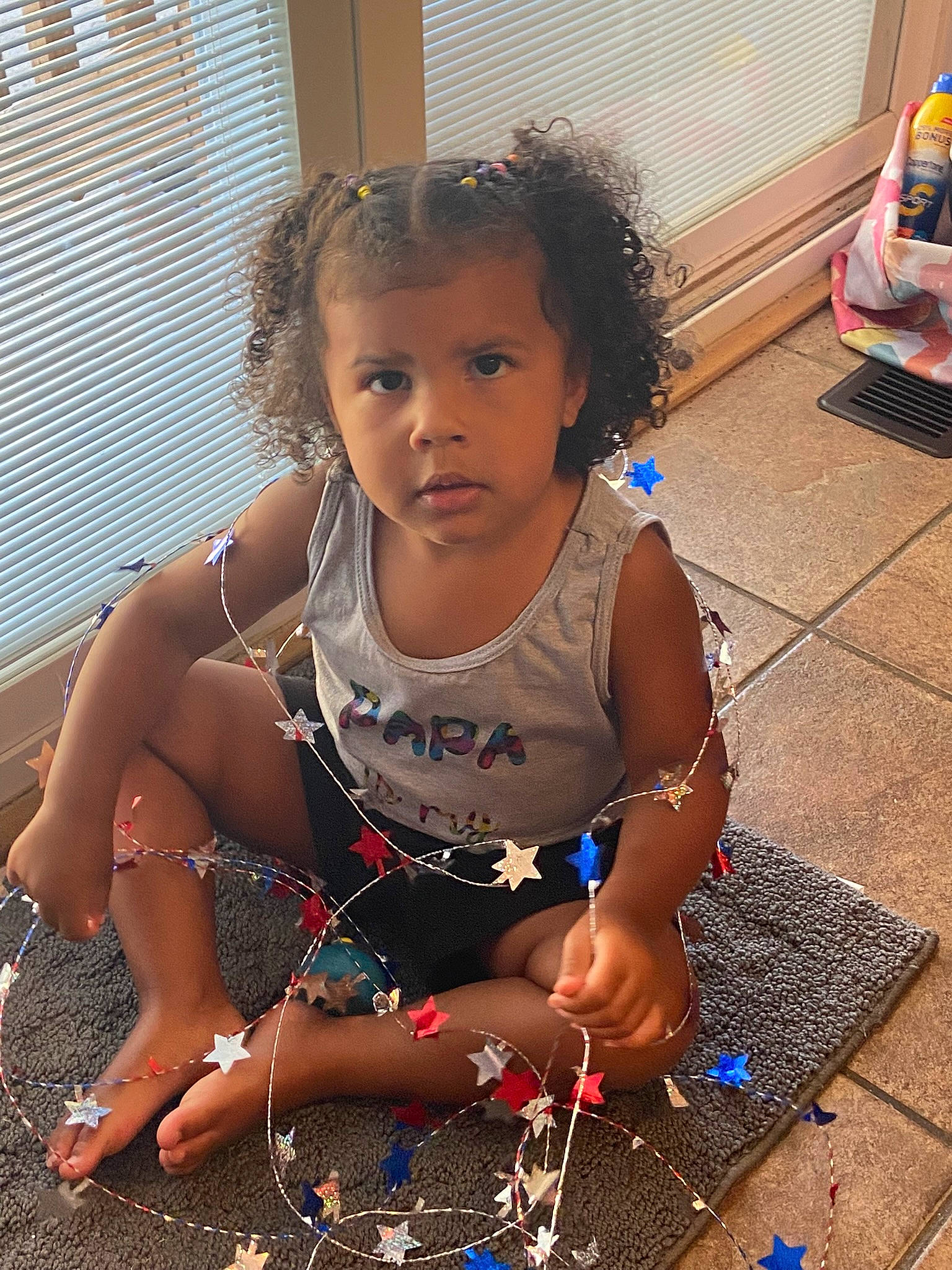 Danya is registered to the contest to win money with this photo: audio_equipment, backpack, bag, child, event, floor, flooring, fun, happy, human_leg, leisure, luggage_and_bags, person, play, sitting, soil, thigh, toddler, vacation, window