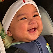 Andy joined the competition — help win amazing prizes! baby, smiling, face, beanie, hat, clothing, infant, cute, portrait, child, happy, cozy, seatbelt, carseat, apparel, cheeks, expression, closeup, indoor, pillow