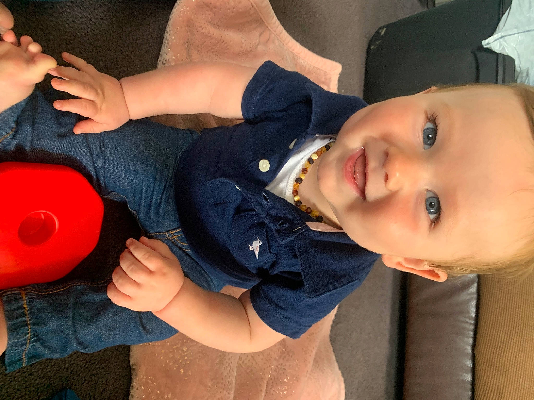 Corbyn is registered to the contest to win money with this photo: arm, baby, black_hair, cheek, child, ear, elbow, face, head, joint, leg, mouth, neck, nose, person, photography, selfie, toddler