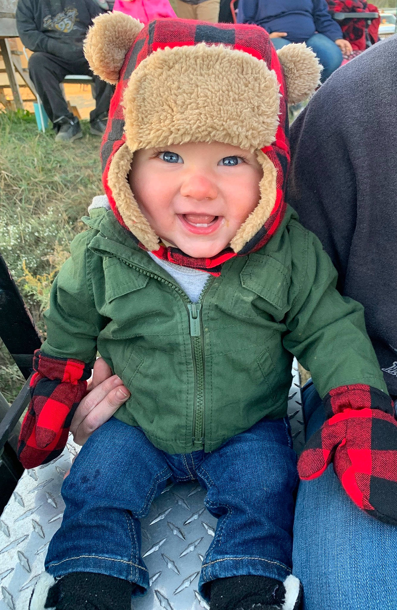 Corbyn joined the competition — help win amazing prizes! child, face, fun, head, headgear, headwear, jacket, knit_cap, outerwear, people, person, plant, play, playing_in_the_snow, red, sitting, skin, smile, snow, toddler