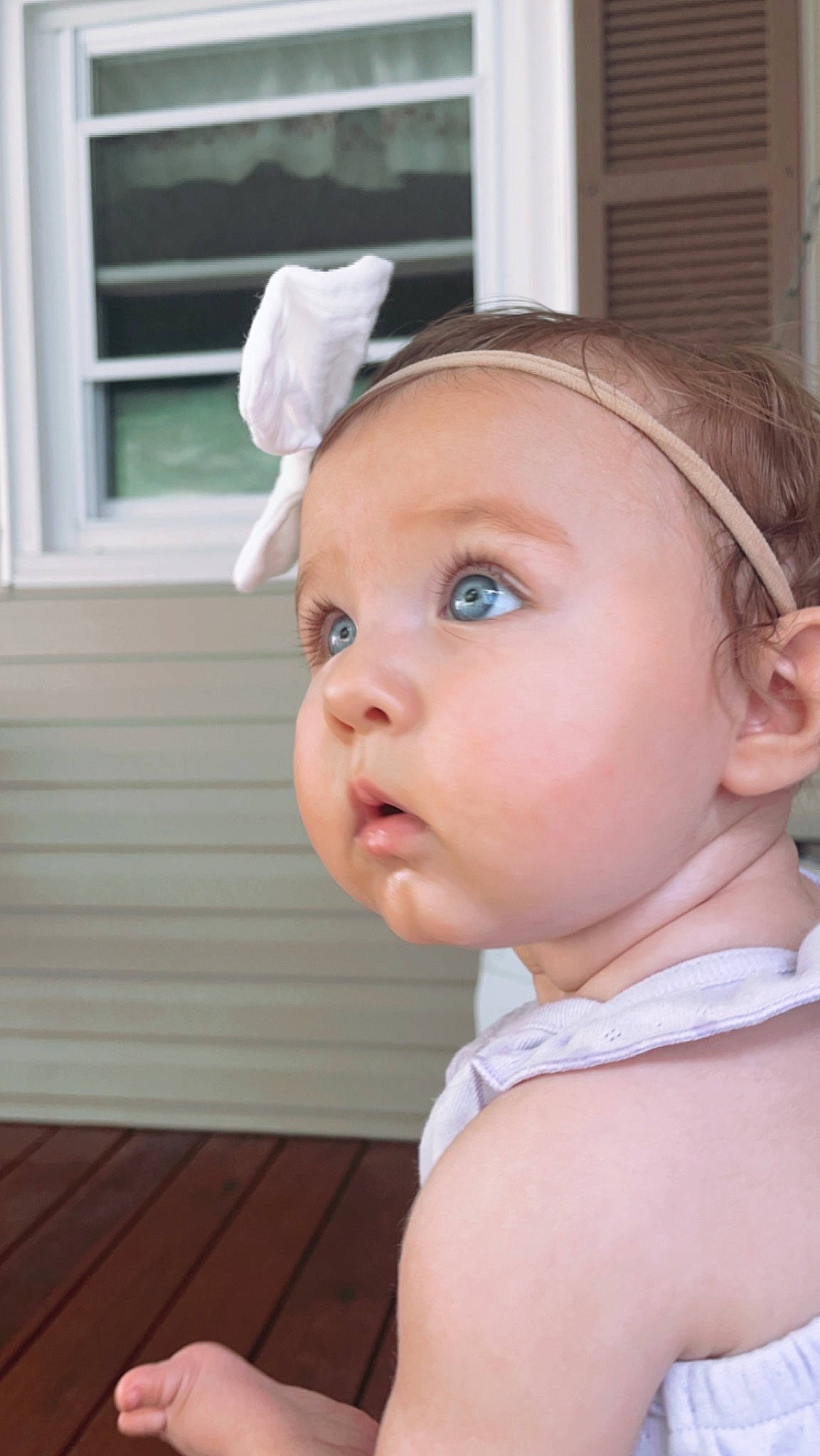 Natalie joined the competition — help win amazing prizes! baby, baby_toddler_clothing, cheek, child, dress, ear, eyelash, fashion_accessory, flooring, grass, hair_accessory, happy, hardwood, headband, headpiece, lip, person, sitting, surprise, toddler