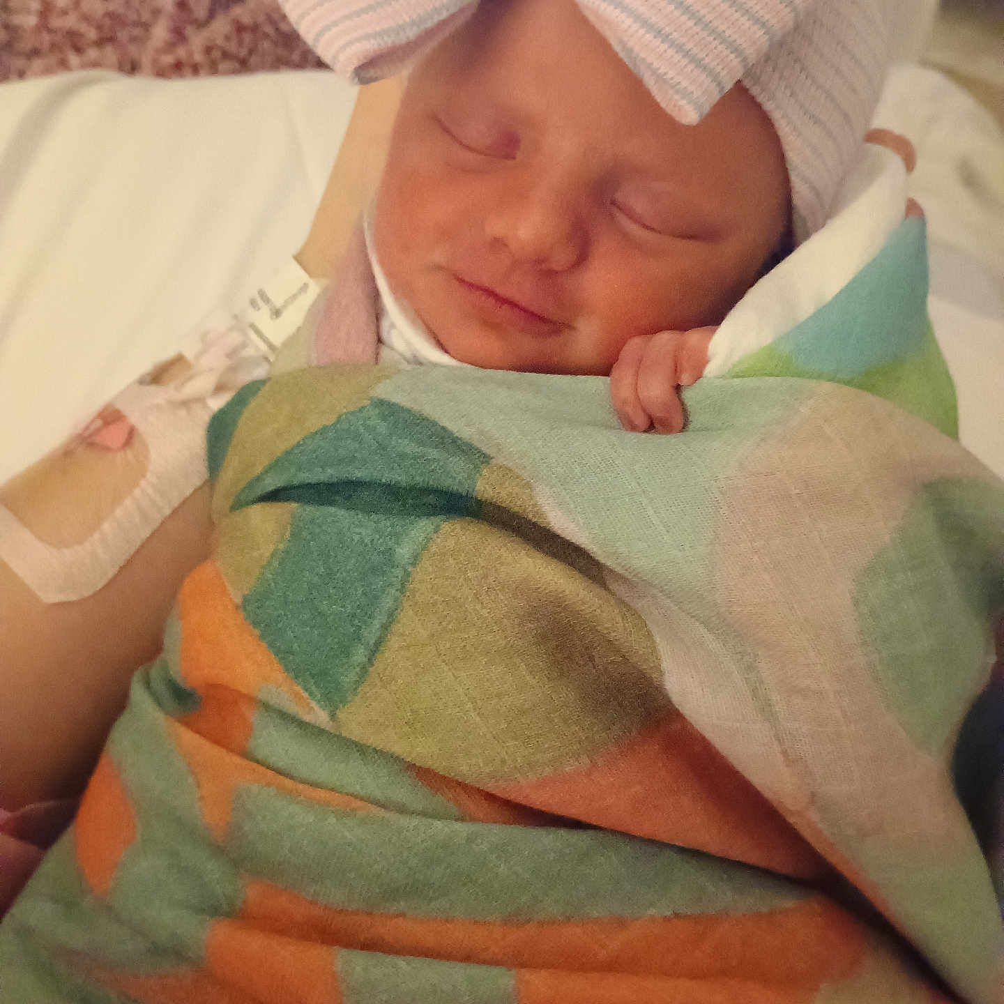 Rosaleigh is registered to the contest to win money with this photo: architecture, baby, bed, blanket, bodypart, building, clothing, couch, face, finger, furniture, hand, hat, head, hospital, newborn, person, quilt, sleeping, towel