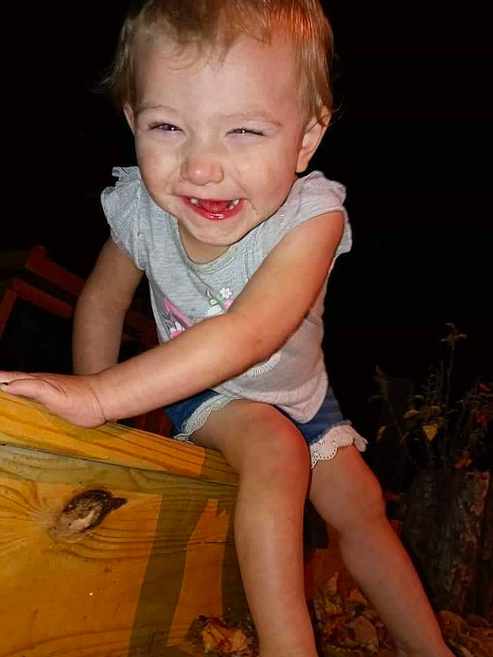 Lalyla is registered to the contest to win money with this photo: baby, baby_toddler_clothing, cheek, child, dress, facial_expression, finger, flash_photography, fun, grass, happy, joy, leg, nose, person, plant, skin, smile, t_shirt, thigh