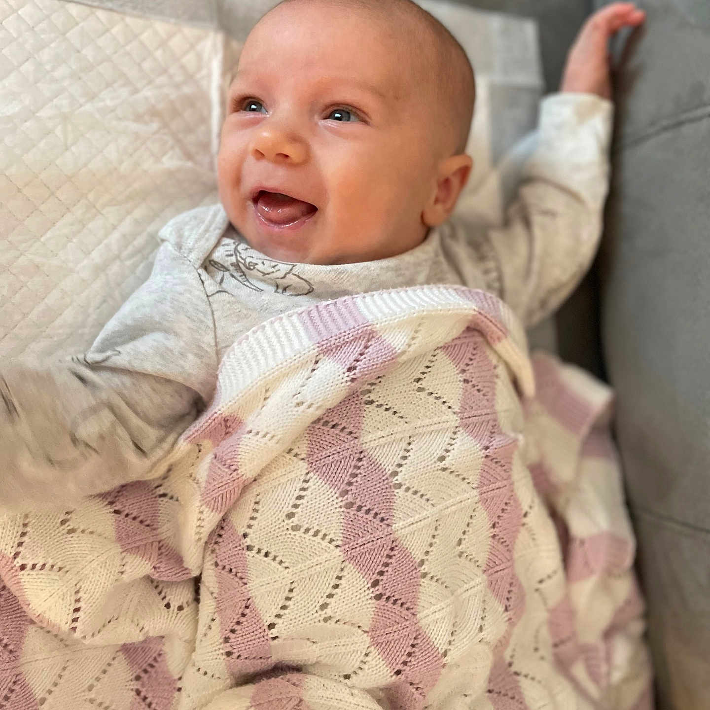 Benjamin James Slava joined the competition — help win amazing prizes! baby, blanket, child, clothing, comfort, cozy, cute, expression, face, happy, indoor, infant, knitted, lying_down, portrait, resting, smiling, soft, toddler, warm