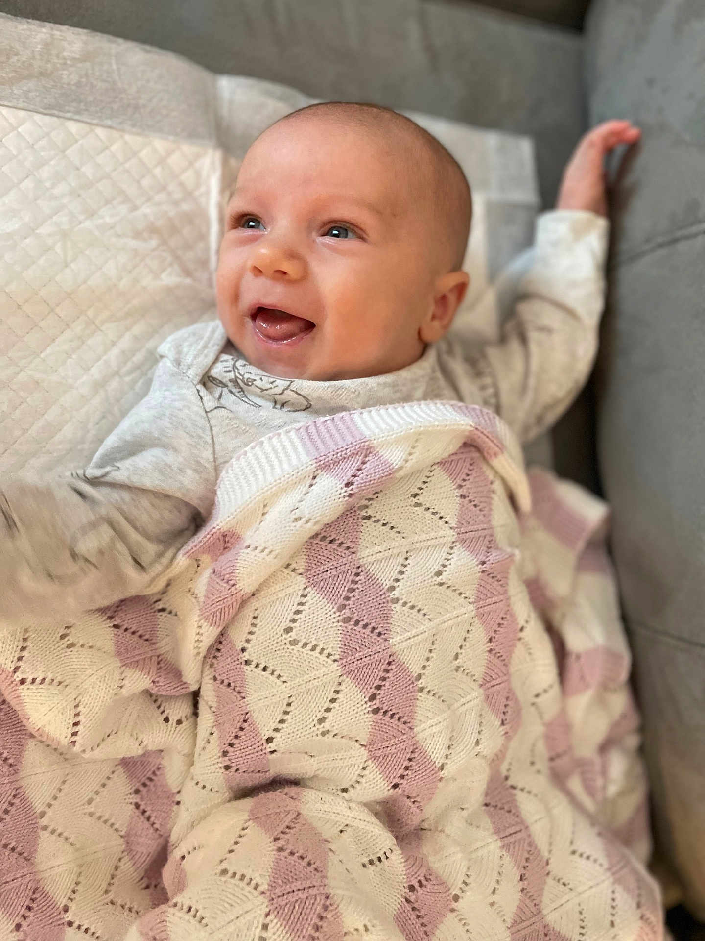 Benjamin James Slava joined the competition — help win amazing prizes! baby, blanket, smiling, happy, infant, cute, knitted, cozy, portrait, child, face, expression, lying_down, soft, comfort, clothing, resting, indoor, toddler, warm