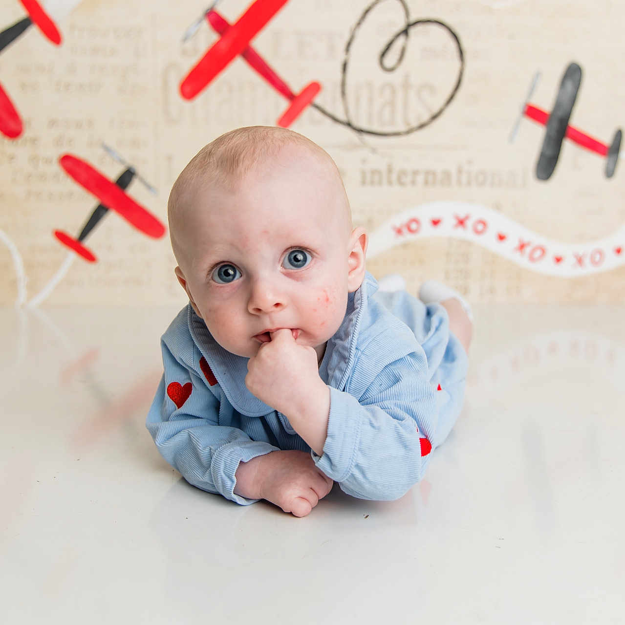 Tritt is registered to the contest to win money with this photo: aircraft, airplane, baby, bodypart, crawling, face, finger, hand, handwriting, happy, head, person, photography, portrait, sitting, smile, text, transportation, vehicle, whiteboard