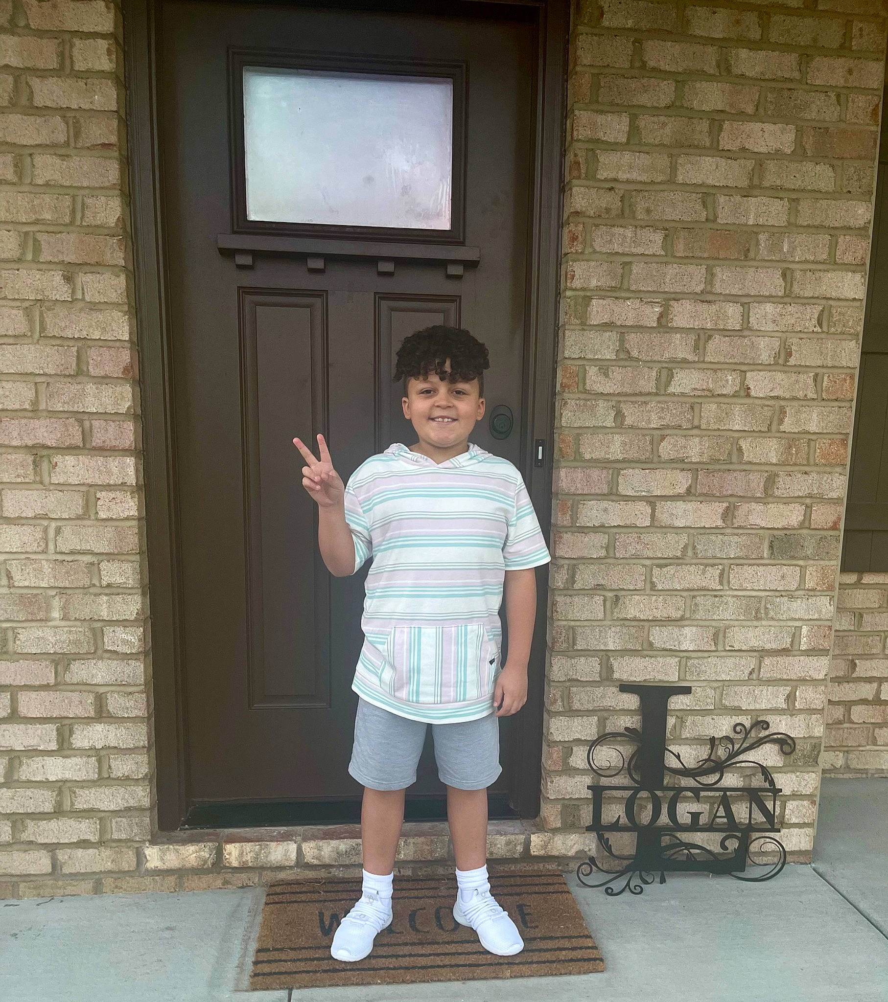 Roman joined the competition — help win amazing prizes! bag, bicycle_wheel, brick, brickwork, building, child, concrete, door, home_door, house, human_leg, joy, person, room, shorts, sleeve, standing, t_shirt, television, tire