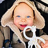 baby, child, blue_eyes, smile, hood, coat, fur_lined, teether, giraffe_toy, hand, blanket, infant, cute, face, portrait, warm_clothing, happy, indoors, close_up, person
