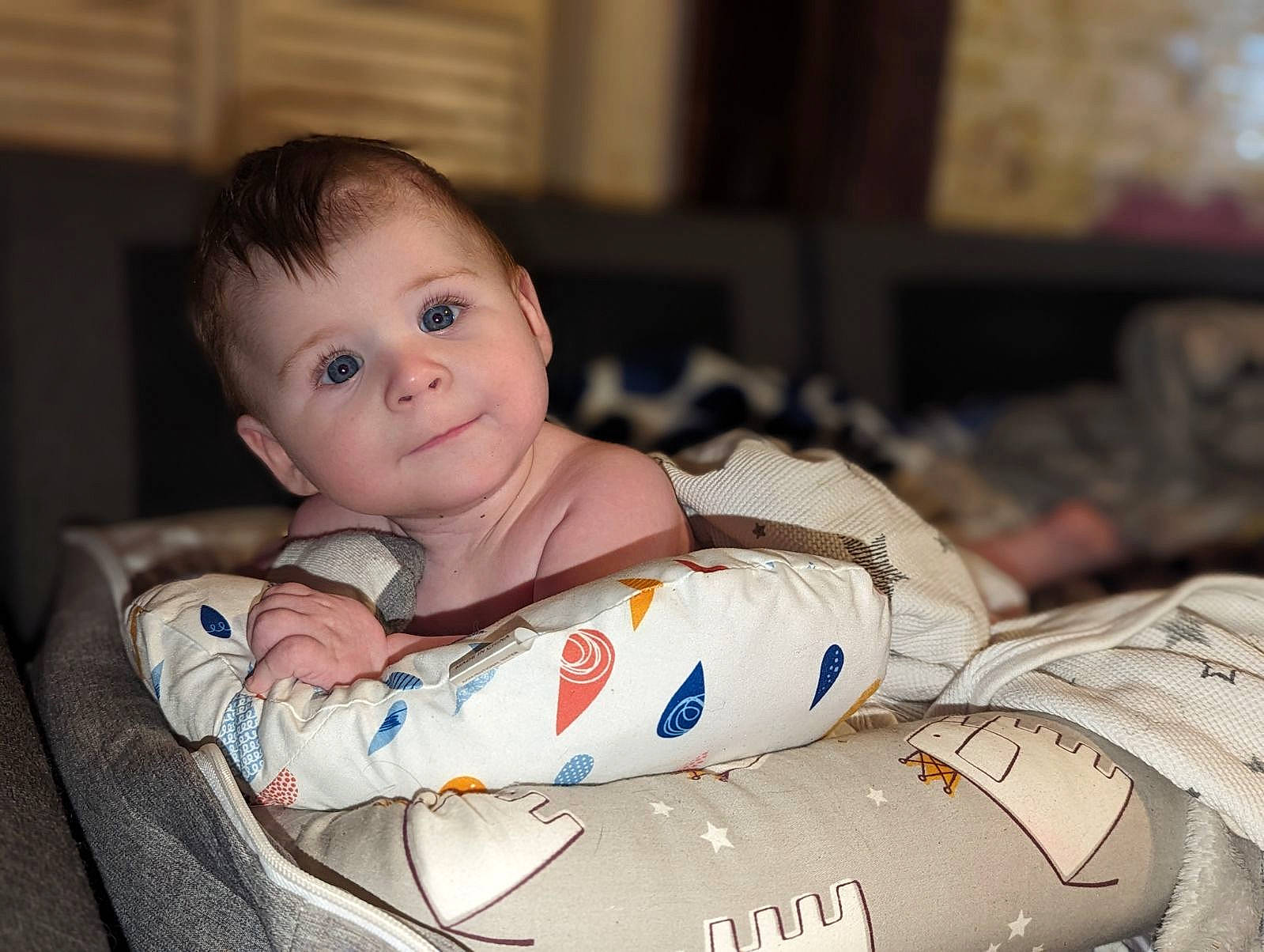 Chandler is registered to the contest to win money with this photo: baby, baby_toddler_clothing, carmine, chair, child, comfort, eye, flash_photography, flooring, fun, happy, human_leg, iris, linens, person, portrait_photography, room, sitting, t_shirt, toddler