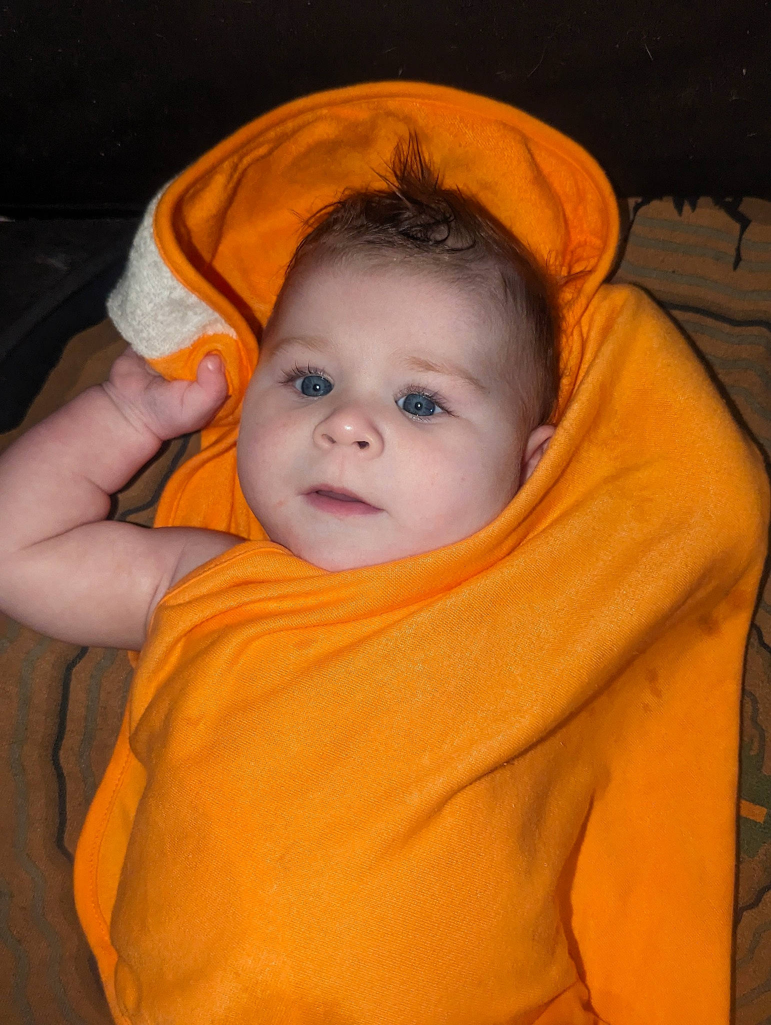 Chandler is registered to the contest to win money with this photo: baby, baby_toddler_clothing, cheek, child, chin, comfort, eye, eyebrow, forehead, fun, happy, iris, lip, mouth, neck, nose, orange, person, skin, smile