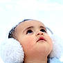 baby, child, face, earmuffs, winter, snow, cold, portrait, closeup, fluffy, cute, looking_up, headwear, outdoor, skin, eyelashes, winter_clothing, young, innocent, soft