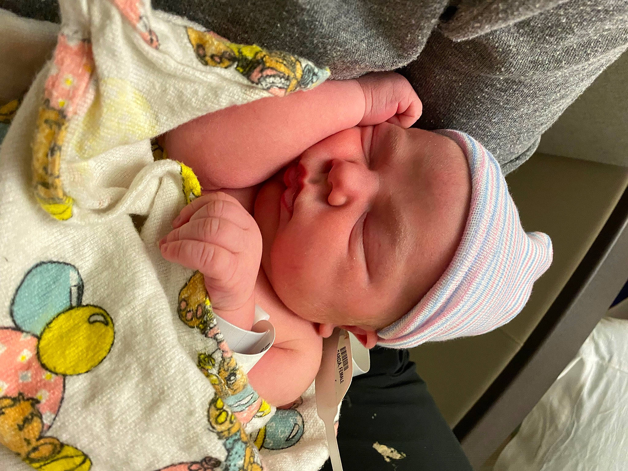 Zia is registered to the contest to win money with this photo: baby, baby_products, baby_sleeping, baby_toddler_clothing, cheek, comfort, eye, finger, hand, happy, headwear, human_body, mouth, nail, nose, pattern, person, skin, textile, thumb