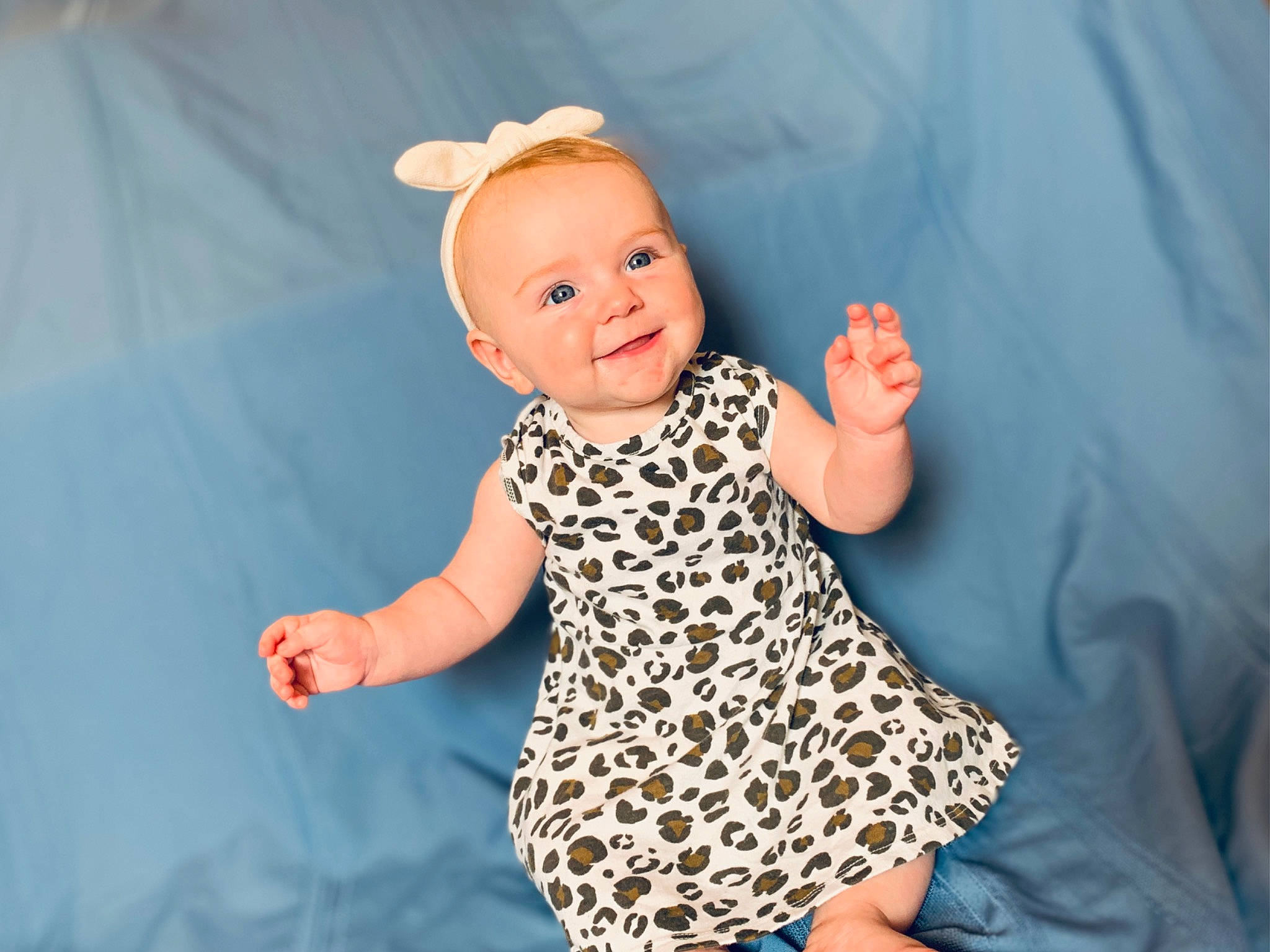 Zia is registered to the contest to win money with this photo: baby, baby_toddler_clothing, child, electric_blue, finger, flash_photography, fun, gesture, happy, hat, joy, pattern, people_in_nature, person, skin, sleeve, smile, t_shirt, textile, thumb