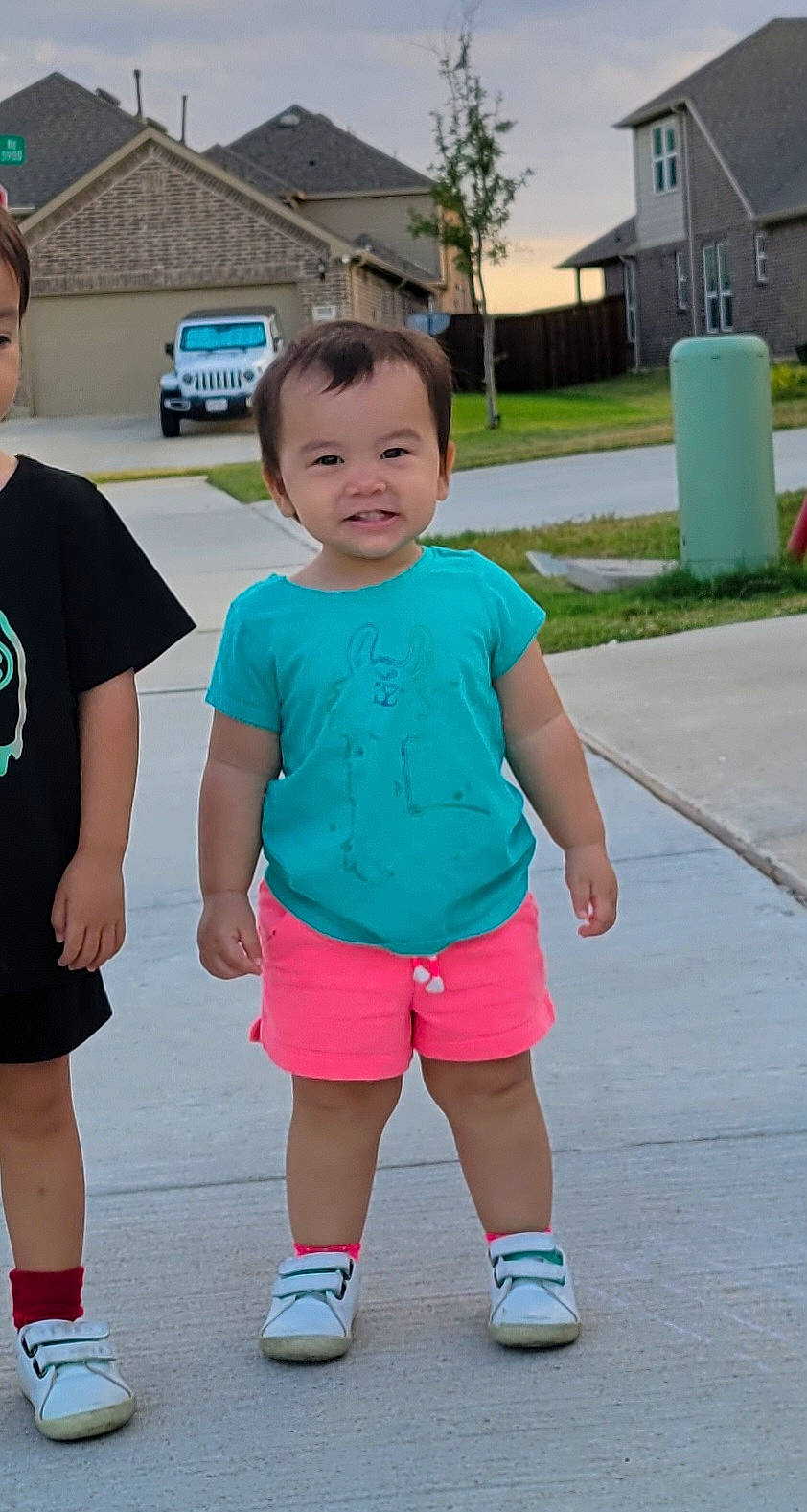 Ayla is registered to the contest to win money with this photo: active_shorts, baby_toddler_clothing, cool, electric_blue, fun, happy, human_body, joint, joy, leisure, person, pink, plant, recreation, shoe, shorts, shoulder, sleeve, standing, t_shirt