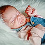 Alba participe au concours pour gagner de l'argent avec cette photo : baby, sleeping, denim, overalls, pink_sweater, infant, closeup, soft_texture, fluffy, peaceful, resting, cute, newborn, skin, hand, face, portrait, cozy, child, indoors
