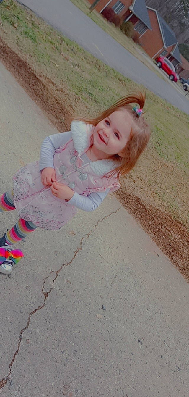 Alivia joined the competition — help win amazing prizes! asphalt, baby_toddler_clothing, child, city, concrete, flooring, foot, fun, grass, happy, human_leg, joy, leisure, person, play, road_surface, sand, sidewalk, sitting, smile