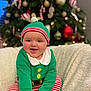 baby, babylaughing, cap, clothing, couch, face, festival, furniture, happy, hat, head, laughing, lighting, person, photography, plant, portrait, pottedplant, smile, tree